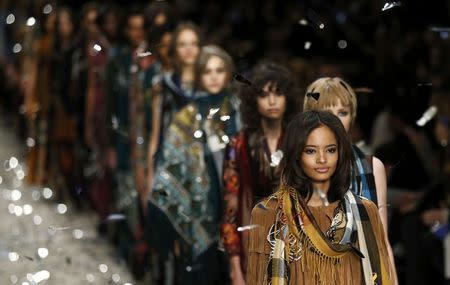 Models present creations from the Burberry Prorsum Autumn/Winter 2015 collection during London Fashion Week in this February 23, 2015 file photo. REUTERS/Suzanne Plunkett/Files
