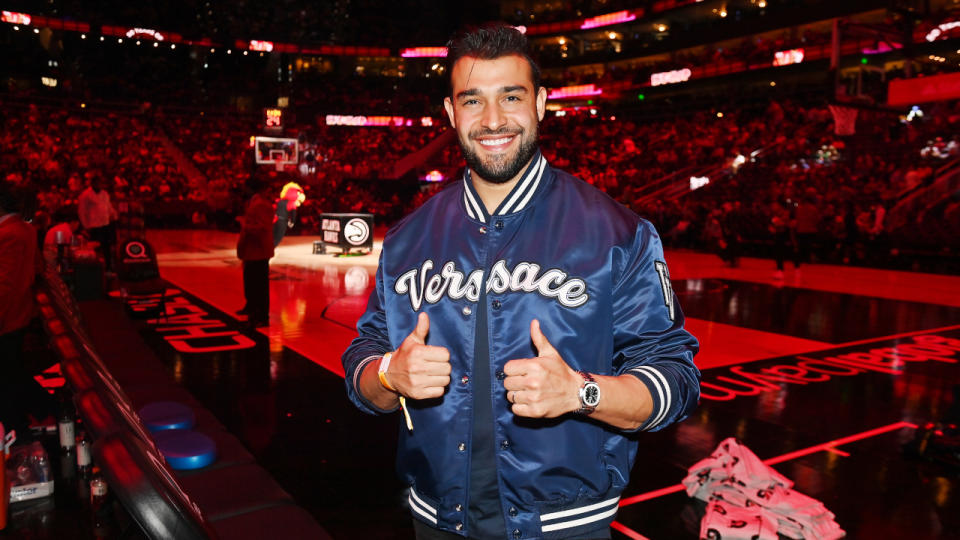 ATLANTA, GEORGIA - APRIL 02: Sam Asghari attends the game between the Dallas Mavericks and the Atlanta Hawks at State Farm Arena on April 02, 2023 in Atlanta, Georgia