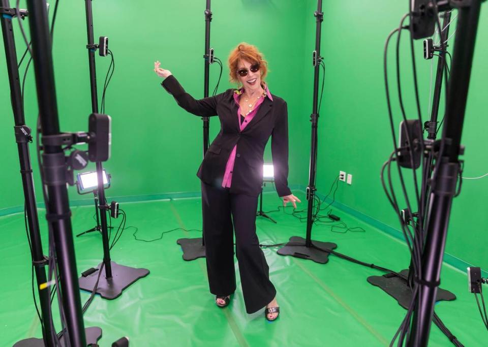 Janet Goldman strikes a pose while using the iSTAR Volumetric Capture Studio at the Lee Caplin School of Journalism & Media at Florida International University Biscayne Bay Campus on Friday, Nov. 17, 2023, in North Miami, Fla.