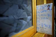 A letter is pictured in the door of a locked classroom at Danwon High School, where the missing students on the sunken ferry are enrolled in Ansan on April 17, 2014