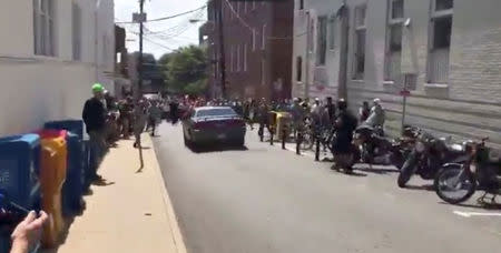 A vehicle is seen before plowing into the crowd gathered on a street in Charlottesville, Virginia, after police broke up a clash between white nationalists and counter-protesters, in this still image from a video obtained from social media. Courtesy of Brennan Gilmore/via REUTERS