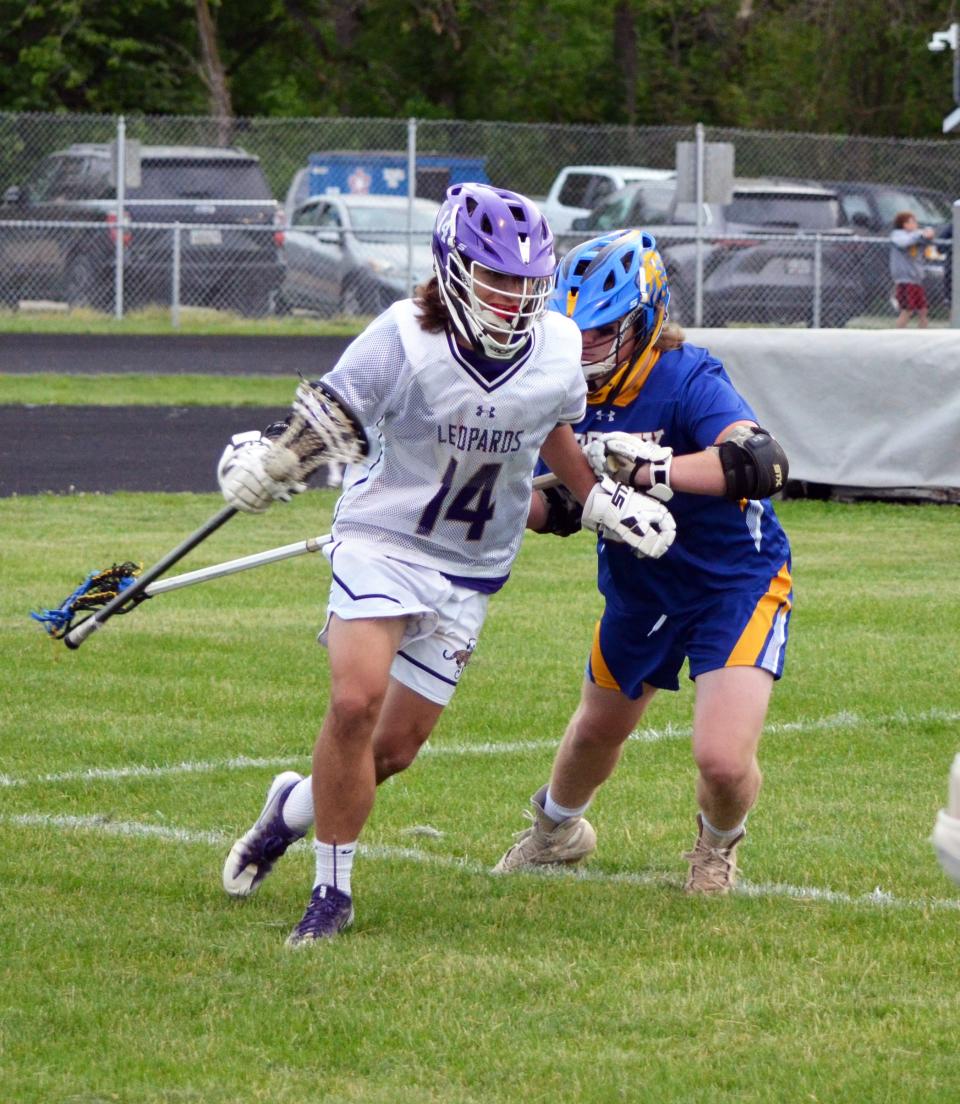 Smithsburg's Blake Linn (14) is defended by Liberty's Nicolas Marsicano in their the Maryland Class 1A state quarterfinal game. Linn had four goals and an assist in the Leopards' 18-10 win.