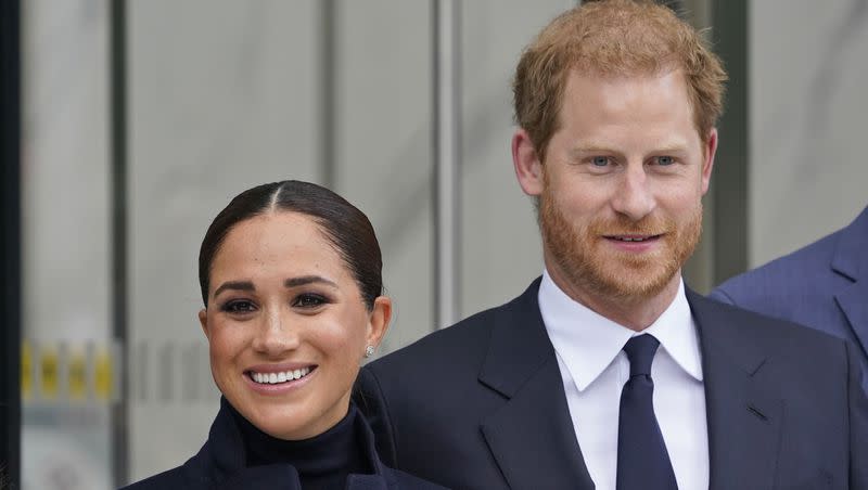 Meghan Markle and Prince Harry pose for pictures after visiting the observatory in One World Trade. It is not yet known if Harry and Meghan will attend the coronation for King Charles III.