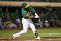 Oakland Athletics' Starling Marte hits a three-run home run off Texas Rangers pitcher Jimmy Herget during the 11th inning of a baseball game Friday, Aug. 6, 2021, in Oakland, Calif. The A's won 4-1. (AP Photo/D. Ross Cameron)