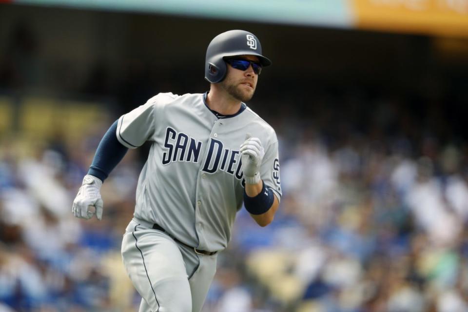 San Diego Padres second baseman Ryan Schimpf watches the ball after hitting a home run during the seventh inning of a baseball game against the Los Angeles Dodgers, Monday, April 3, 2017, in Los Angeles. (AP Photo/Ryan Kang)