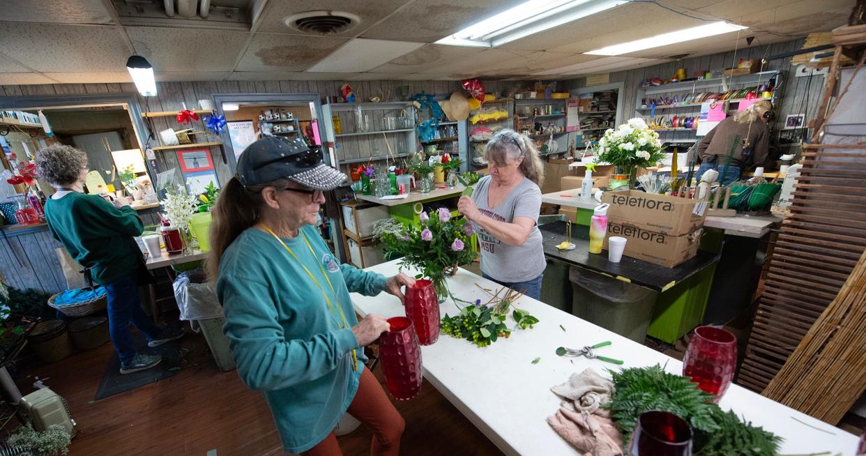 The back room at Whitley's Florist & Flower Delivery on Lakeland Drive in Jackson bustles as the team works to get Valentine's Day orders out Tuesday, Feb. 13, 2024.