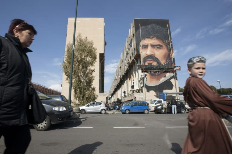 A picture shows the unfinished mural of football superstar Diego Armando Maradona by Italian artist Jorit Agoch in a district known as the "Bronx" in San Giovanni a Teduccio near Naples