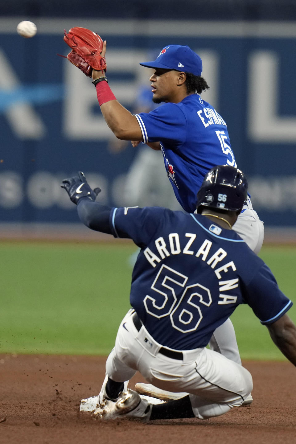 Toronto Blue Jays second baseman Santiago Espinal forces Tampa Bay Rays' Randy Arozarena (56) at second base during the fourth inning of a baseball game Saturday, May 14, 2022, in St. Petersburg, Fla. (AP Photo/Chris O'Meara)