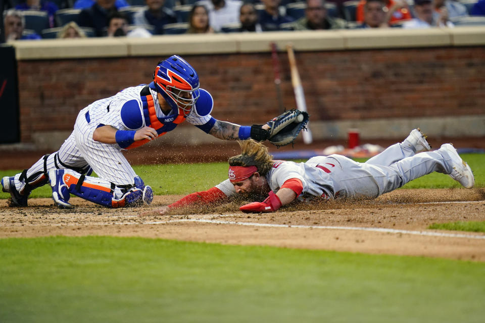 St. Louis Cardinals' Brendan Donovan, right, slides past New York Mets catcher Tomas Nido to score on a Paul Goldschmidt double during the fourth inning in the second baseball game of a doubleheader Tuesday, May 17, 2022, in New York. (AP Photo/Frank Franklin II)