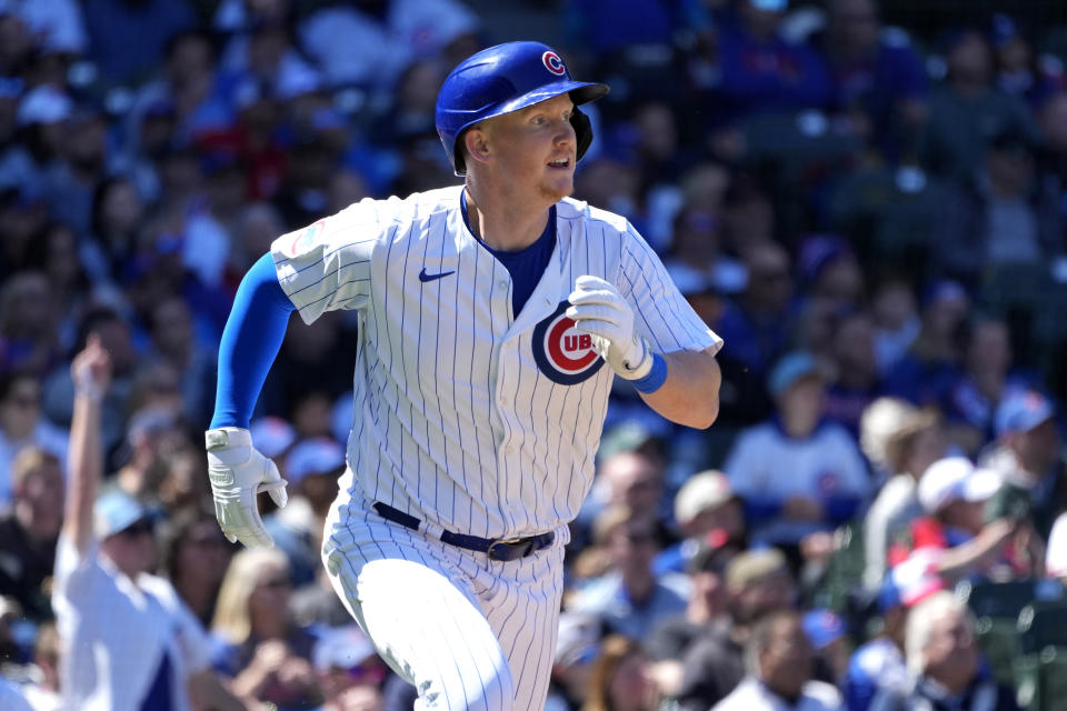 Chicago Cubs' Garrett Cooper watches his RBI single off Miami Marlins starting pitcher A.J. Puk during the third inning of a baseball game Friday, April 19, 2024, in Chicago. (AP Photo/Charles Rex Arbogast)