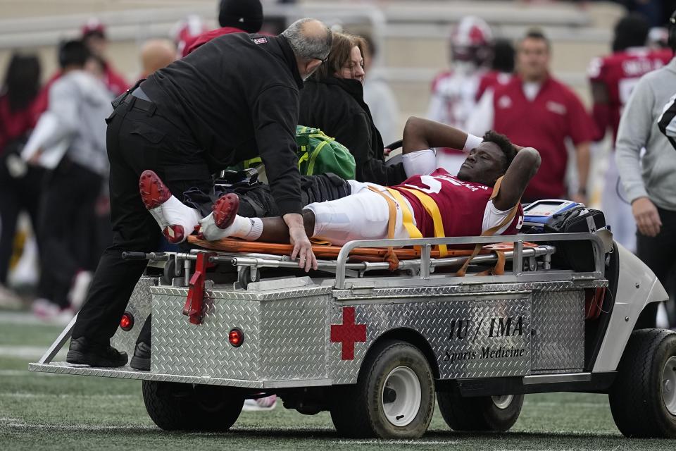 Indiana quarterback Dexter Williams II is carted off the field after getting injured during the first half of an NCAA college football game against Purdue, Saturday, Nov. 26, 2022, in Bloomington, Ind. (AP Photo/Darron Cummings)