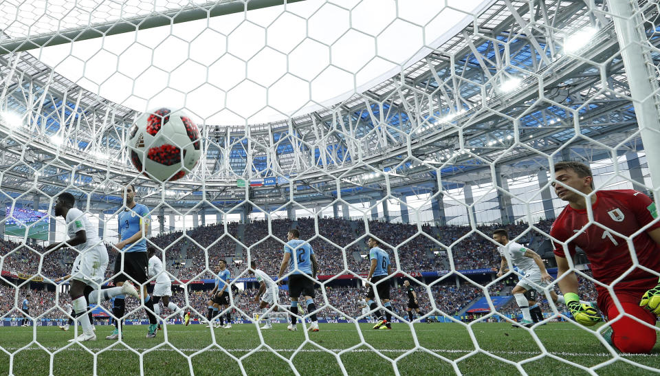 <p>Uruguay goalkeeper Fernando Muslera is beaten by a header from France’s Raphael Varane </p>