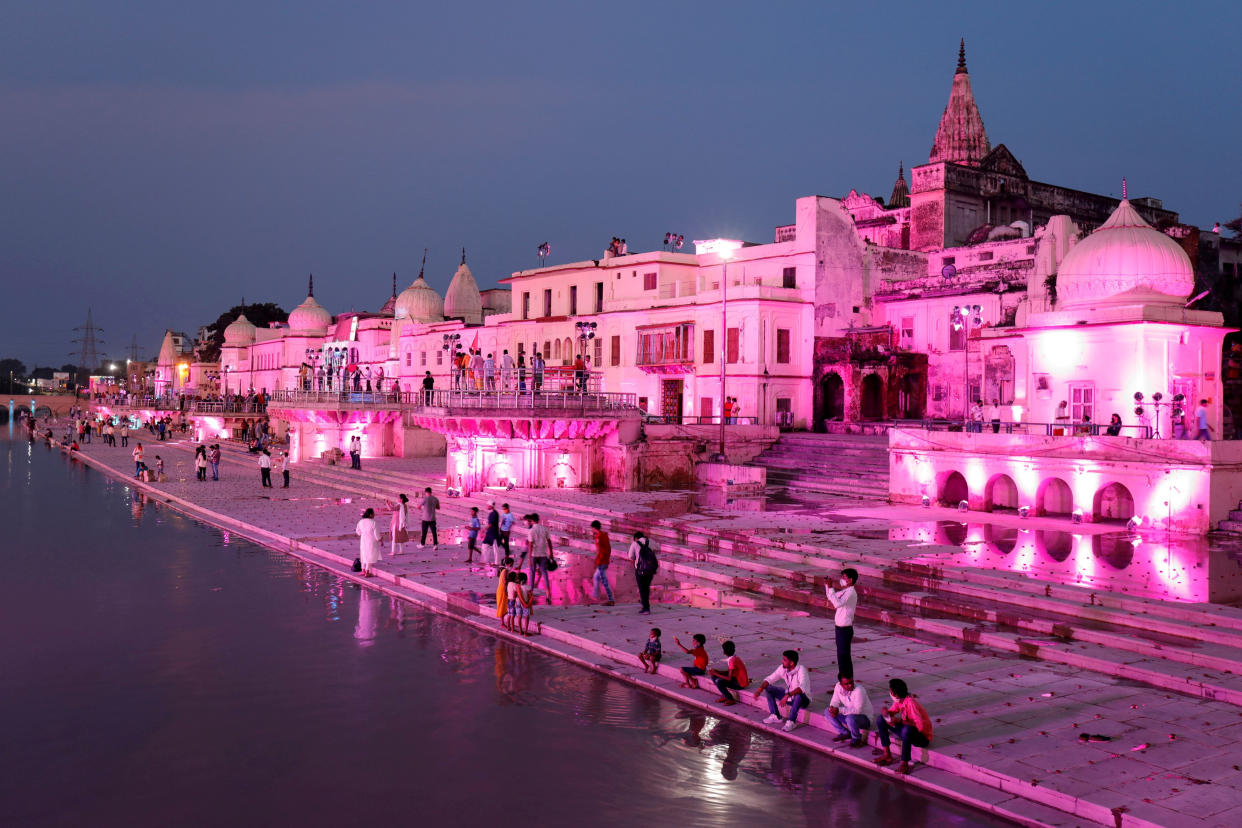 Temples and other buildings on the bank of Sarayu river are seen illuminated ahead of the foundation-laying ceremony for a Hindu temple in Ayodhya, India, August 4, 2020. REUTERS/Pawan Kumar     TPX IMAGES OF THE DAY REFILE - CORRECTING YEAR