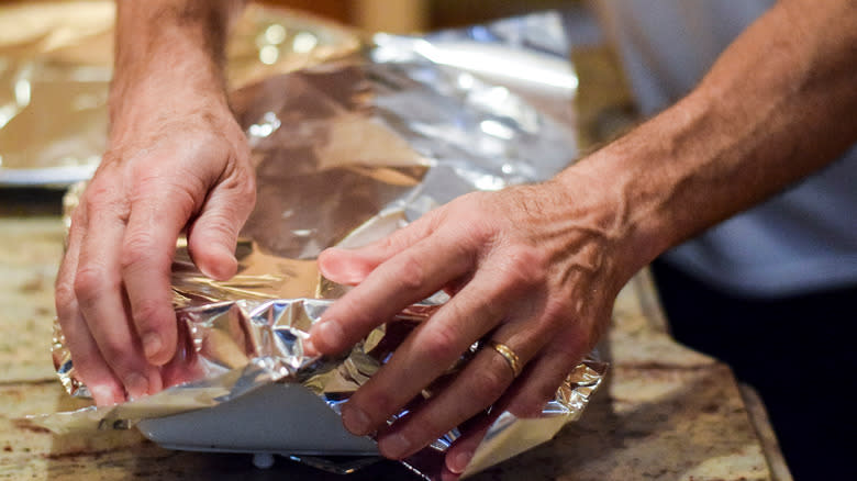 Covering casserole dish with foil