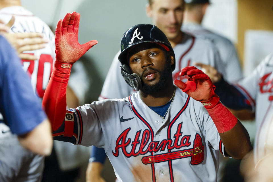 Sep 9, 2022;  Seattle, Washington, USA;  Atlanta Braves center fielder Michael Harris II (23) high-fives teammates in the dugout after hitting a solo home run against the Seattle Mariners during the sixth inning at T-Mobile Park.  Mandatory Credit: Joe Nicholson-USA TODAY Sports