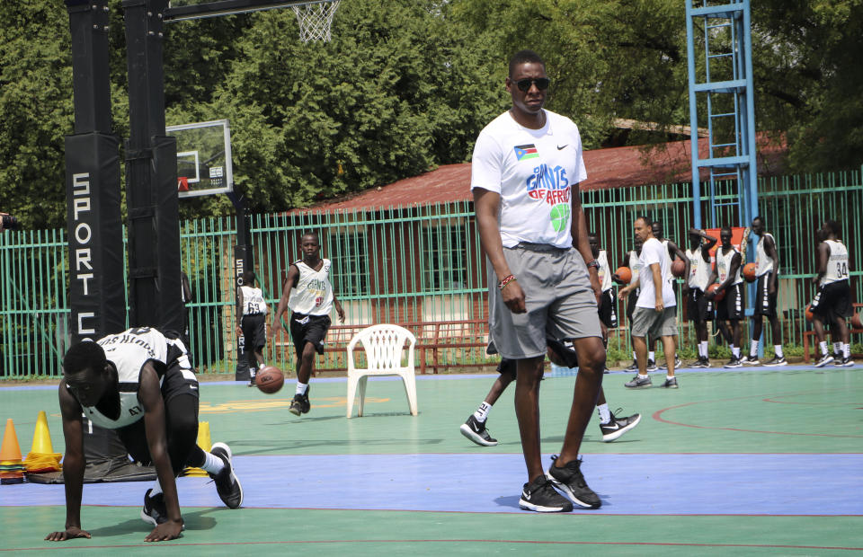 FILE - Masai Ujiri walks on the basketball court during a three-day basketball training camp run by Giants of Africa in Juba, South Sudan on Aug. 20, 2019. Several prospects from the NBA Academy in Africa are playing in the new season of the Basketball Africa League. Now in its third season, the league was created by the NBA in partnership with FIBA to help grow the sport in Africa. (AP Photo/Sam Mednick, File)