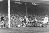 FILE - In this May 18, 1960 file photo, Alfredo Di Stefano, far right, scores the first goal for Real Madrid in the European Cup Final, against Eintracht Frankfurt, at Hampden Park Stadium, in Glasgow. D is for Di Stefano. One of the games all time greats Di Stefan was instrumental in Real Madrid's dominance in the early years of the European Cup. (AP Photo/File)