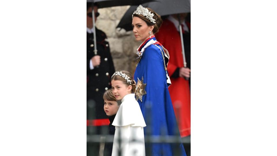 Princess Kate and Princess Charlotte in floral headdresses for the Coronation of King Charles III and Queen Camilla