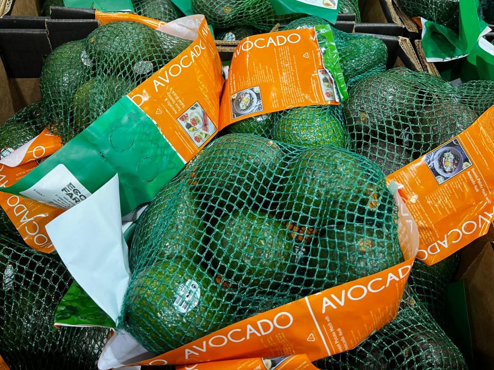 Bags of avocados in boxes at Costco