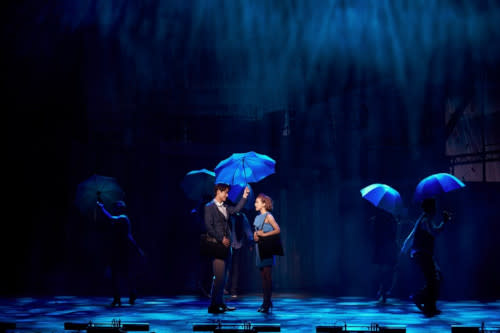 The stage is designed with four thematic scenes with dazzling backdrops.