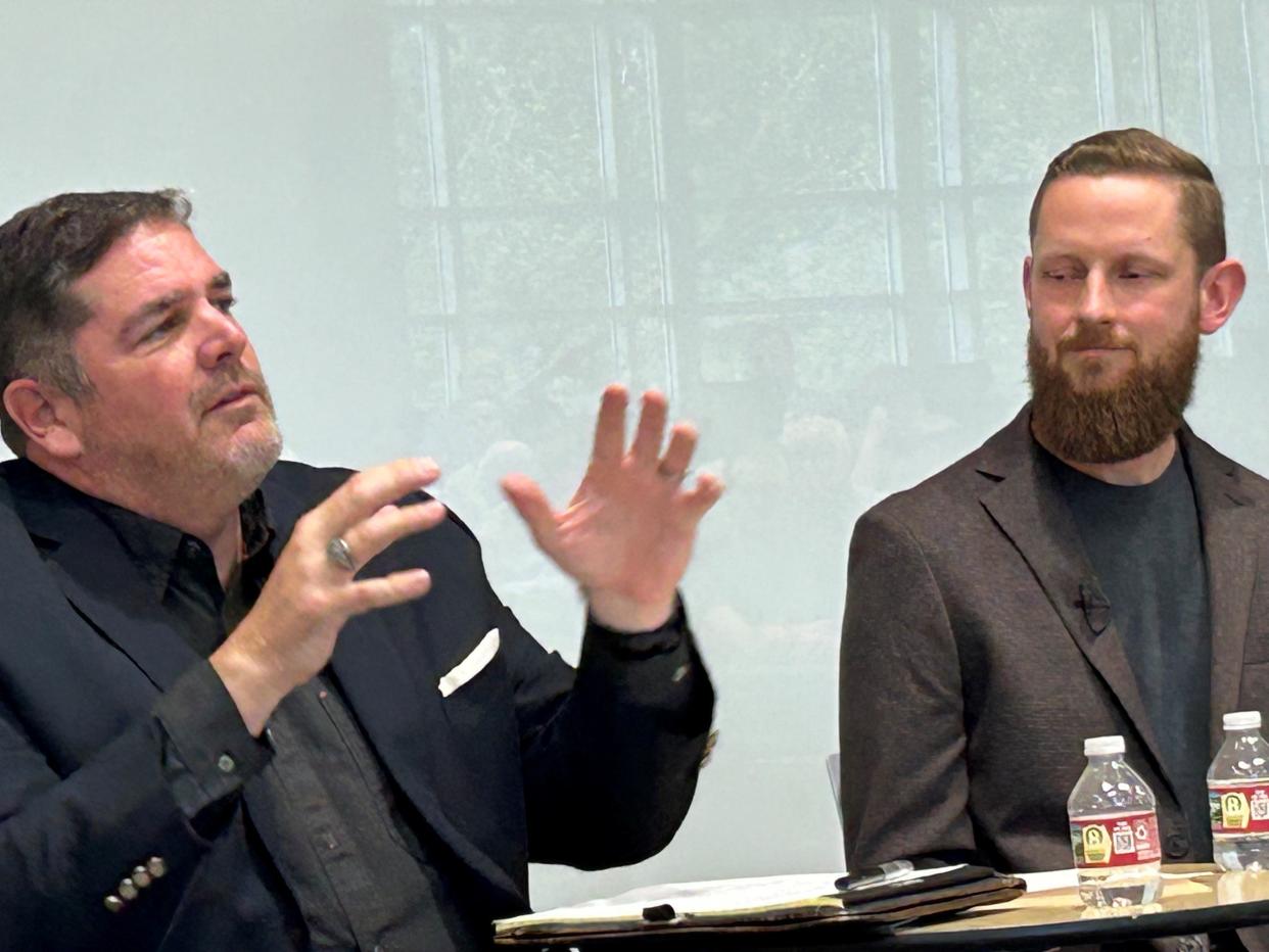 Amazon Web Services economic development director Roger Wehner, left, spoke to a collection of students, faculty and staff at Millsaps College on Wednesday as Senior Solutions Architect Andrew Henderson looked on.