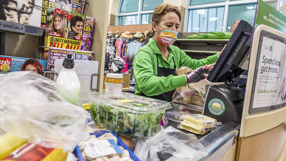 Supermarket checkout by a cashier