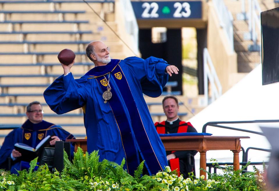 Ukrainian Archbishop Borys Gudziak tosses a football to graduates during the Notre Dame Commencement ceremony Sunday, May 15, 2022 at Notre Dame Stadium in South Bend. 