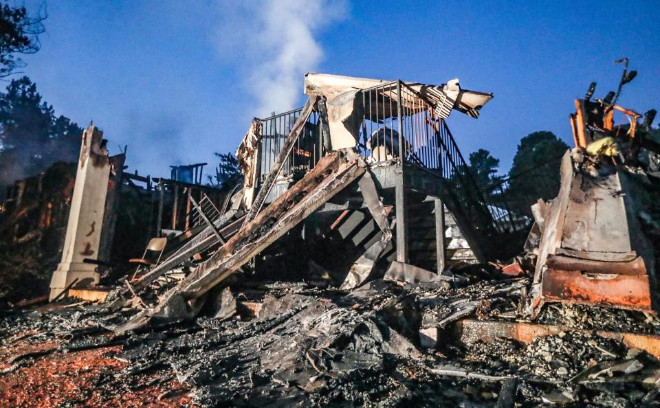 This is what is left of a building destroyed in a fire at The Ashford at Stoneridge Apartments in Clayton County. Photo: John Spink/The Atlanta Journal-Constitution