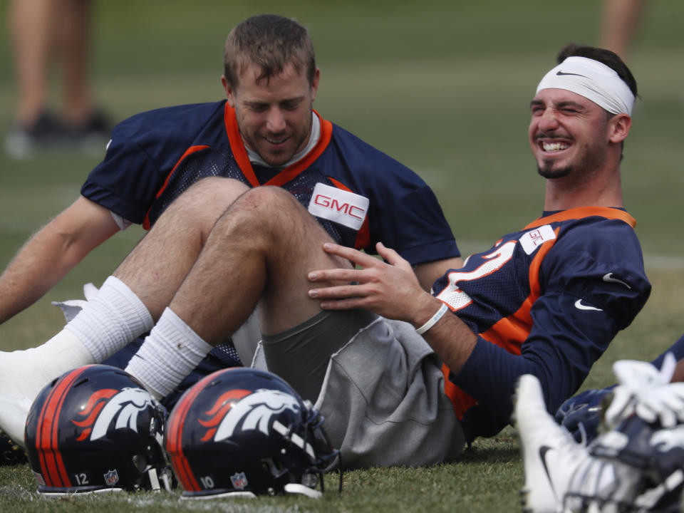 Case Keenum (L) has the No. 1 QB spot locked down in Denver, but things aren’t so clear for Paxton Lynch. (AP)