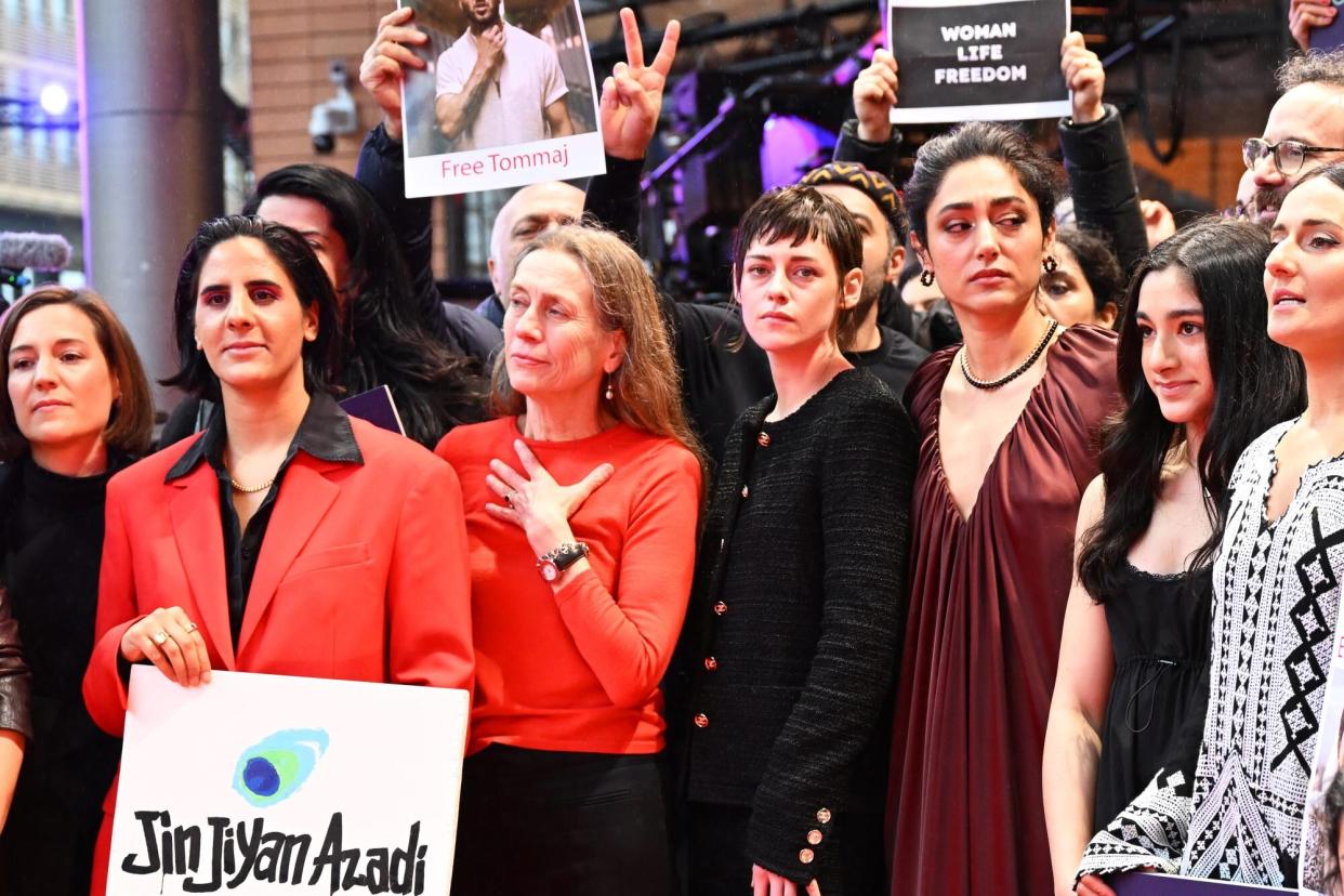 18 February 2023, Berlin: Mariette Rissenbeek (center l), Managing Director Berlinale, Kristen Stewart (M), jury president and actress, and Golshifteh Farahani (center r), jury member and actress, take part in a show of solidarity for women in Iran during the Berlinale. The 73rd International Film Festival runs until February 26, 2023. Photo: Monika Skolimowska/dpa (Photo by Monika Skolimowska/picture alliance via Getty Images)