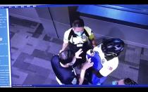 This image made from the Oct. 2, 2020, surveillance camera footage obtained by the website Doha News shows officials care for an abandoned baby at Hamad International Airport in Doha, Qatar. Qatar apologized Wednesday, Oct. 28, 2020, after authorities forcibly examined female passengers from a Qatar Airways flight to Sydney to try to identify who might have given birth to the abandoned newborn baby, even as Australia said it was only one of 10 flights subjected to the searches. (Doha News via AP)