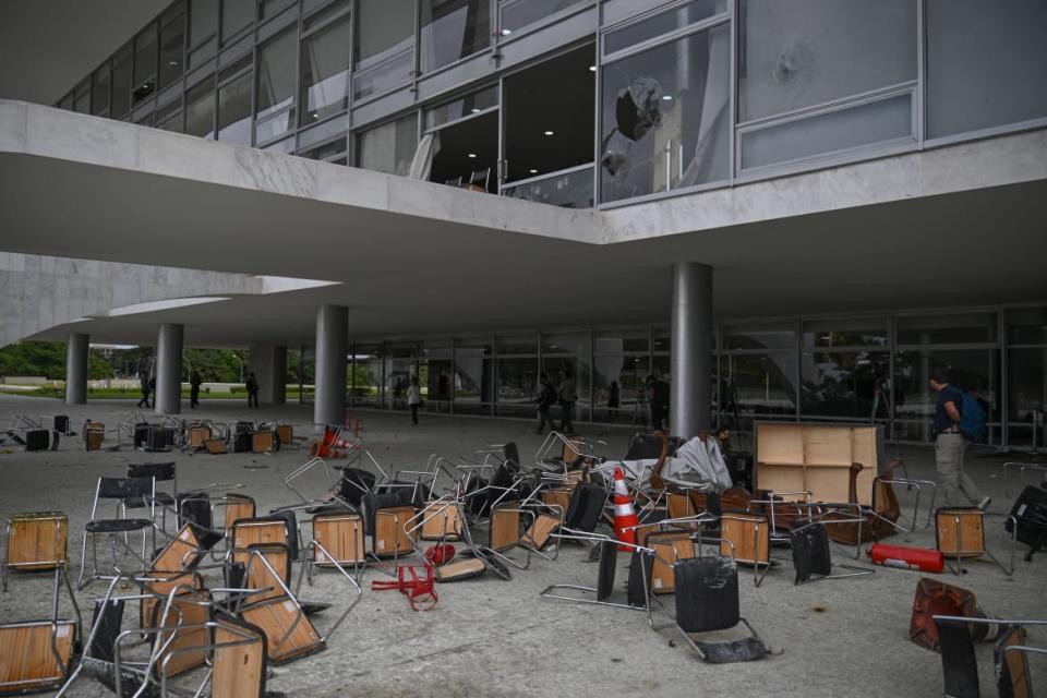 <div class="inline-image__caption"><p>Partial view of one entrance of the Planalto Presidential Palace destroyed by supporters of Brazilian former President Jair Bolsonaro during an invasion, in Brasilia on January 9, 2023.</p></div> <div class="inline-image__credit">CARL DE SOUZA/AFP/Getty</div>