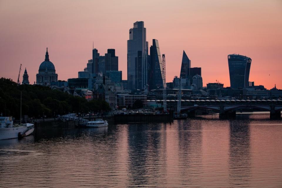 Early morning light bathes the skyscrapers of the City of London financial district (Aaron Chown/PA) (PA Archive)