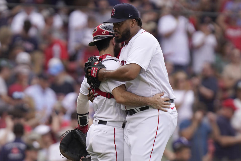 Boston Red Sox's Kenley Jansen, right, celebrates with Connor Wong, left, after they defeated the Oakland Athletics in a baseball game, Sunday, July 9, 2023, in Boston. (AP Photo/Steven Senne)
