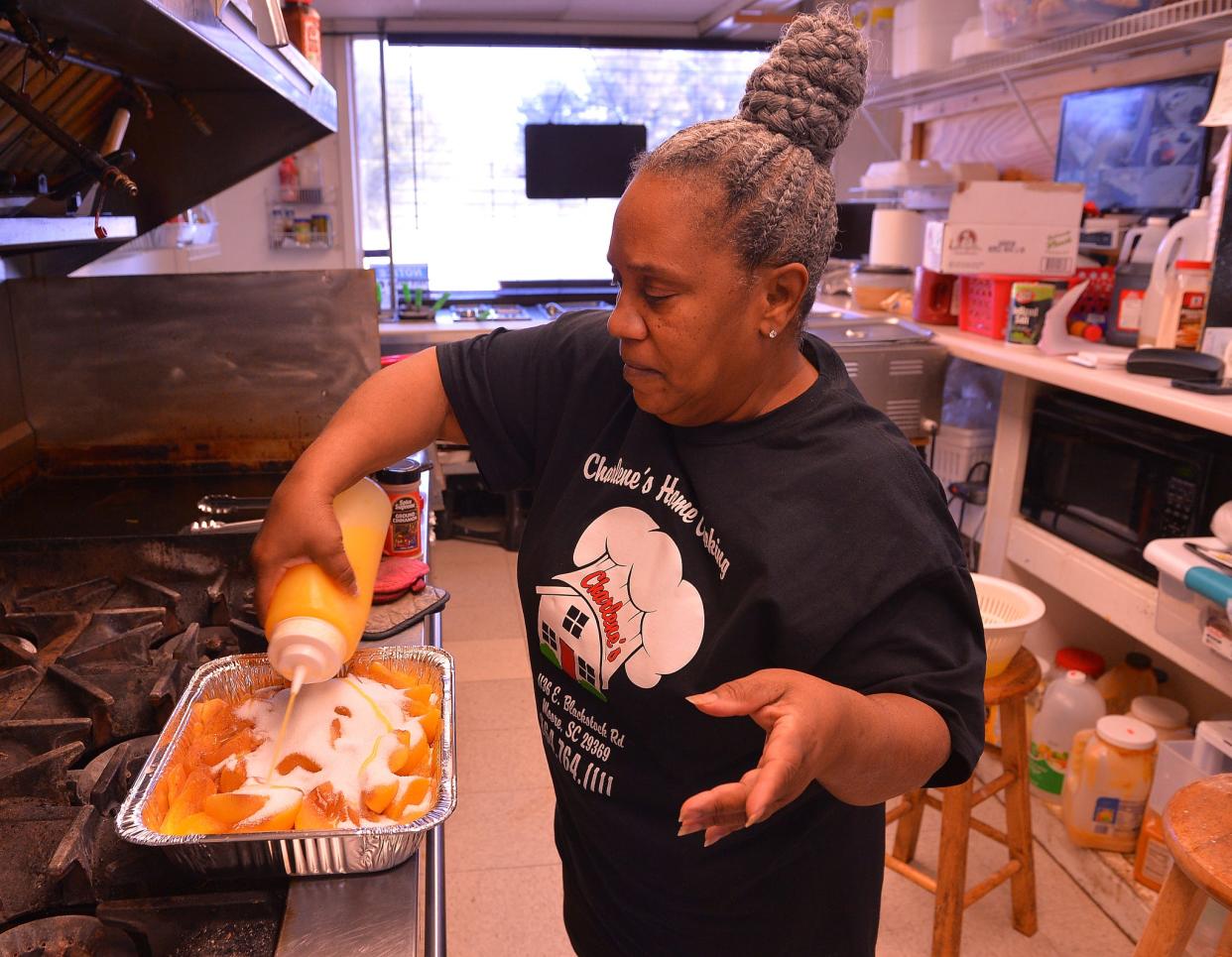 Charlene and Mike Davis own soul food restaurant Charlene's Home Cooking, which serves up dishes based on her grandmother Ma Bessie's recipes. Charlene makes a peach pie at the restaurant in Moore, Monday, February 28, 2022.