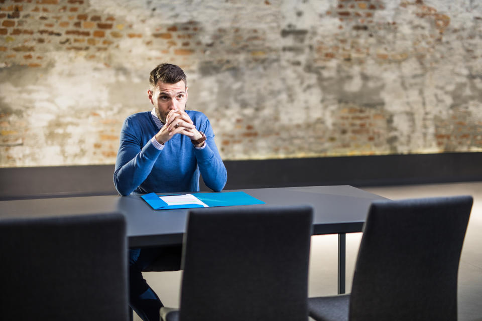 Nervous male candidate waiting for human resource team for a job interview in the office.