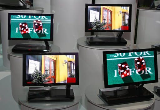 The companies said they would aim to establish mass-production technology for OLED TV panels next year