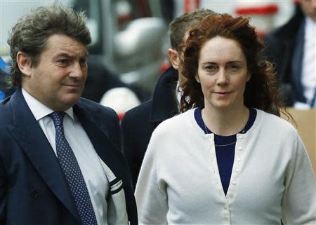 Former News International chief executive Rebekah Brooks and her husband Charlie Brooks (L) arrive at the Old Bailey courthouse in London February 20, 2014. REUTERS/Luke MacGregor