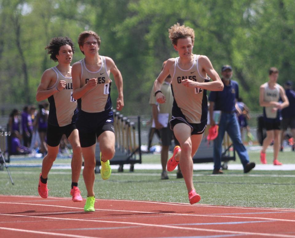 Lancaster's Wes Taylor, right, Zane Schorr, left, and Trevor Lanoy, back, near the finish line in the 800 during the Ohio Capital Conference-Buckeye Division championships on Saturday, May 13, 2023. The trio swept the top three spots in the race with Taylor winning in a time of 1:57.50 for the host Golden Gales, who won the team title.