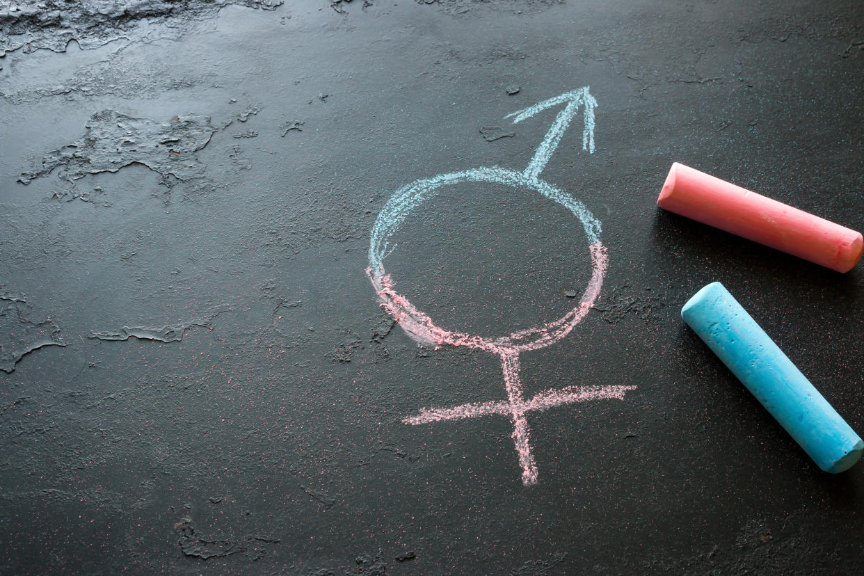 Male-female symbol drawn with chalk. (PHOTO: Getty Creative)