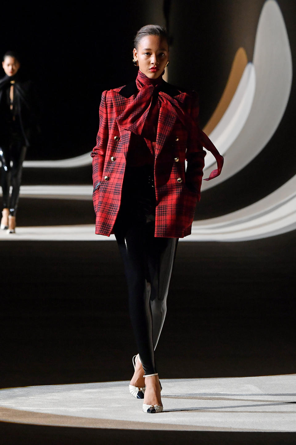 A model walks the runway at the Saint Laurent fall/winter 2020/2021 show during Paris Fashion Week on Feb. 25.&nbsp;