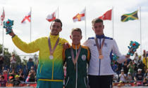 Triathlon - Gold Coast 2018 Commonwealth Games - Men's Final - Southport Broadwater Parklands - Gold Coast, Australia - April 5, 2018 - Gold medallist Henri Schoeman of South Africa, silver medallist Jacob Birtwhistle of Australia, bronze medallist Marc Austin of Scotland. REUTERS/Athit Perawongmetha