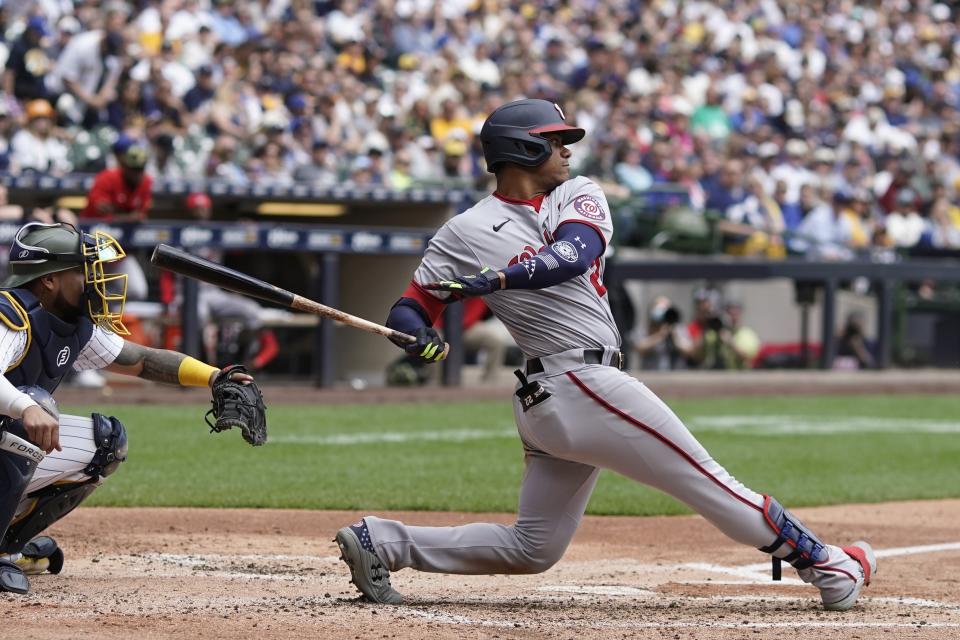 Washington Nationals' Juan Soto hits a two-run scoring single during the fourth inning of a baseball game against the Milwaukee Brewers Sunday, May 22, 2022, in Milwaukee. (AP Photo/Morry Gash)