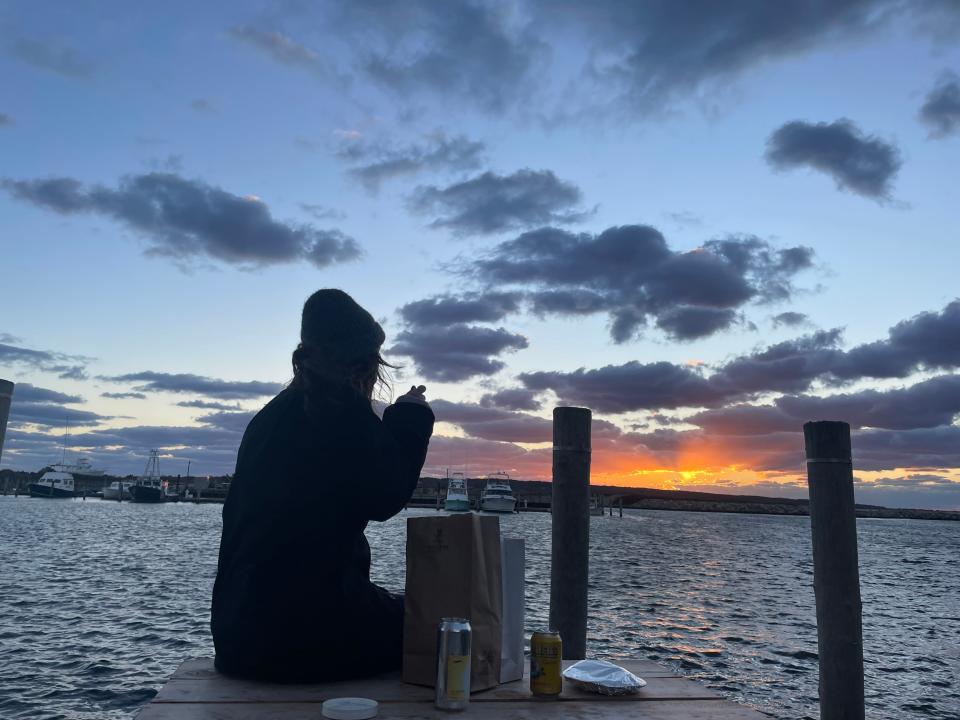 Enjoying fresh seafood in Menemsha in front of another beautiful sunset.