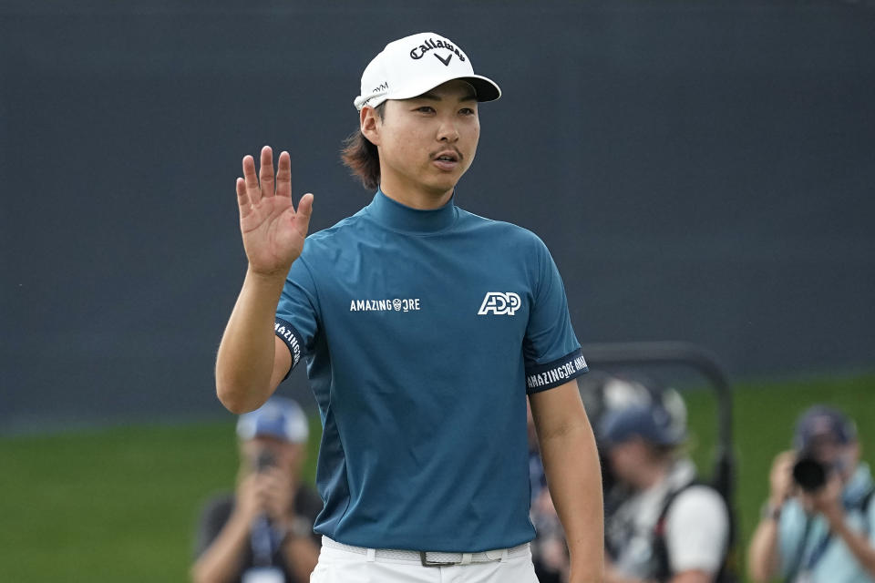 Min Woo Lee reacts on the 18th green during the final round of The Players Championship golf tournament, Sunday, March 12, 2023, in Ponte Vedra Beach, Fla. (AP Photo/Charlie Neibergall)