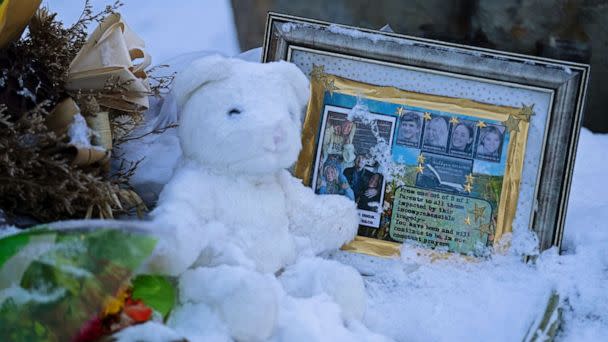 PHOTO: Flowers, a stuffed animal, and a framed image featuring the photos of the four students found dead at a house on Nov. 13, 2022 in Moscow, Idaho, rest in the snow in front of the house on Nov. 29, 2022.  (Ted S. Warren/AP, FILE)