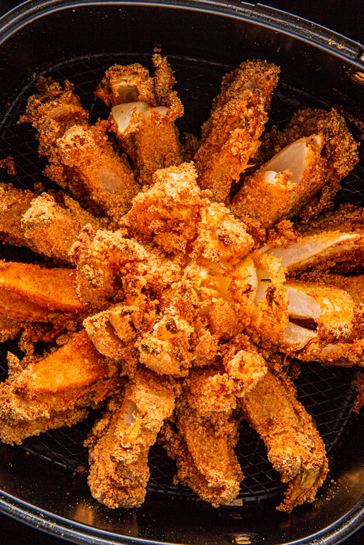 <p>No need to head to Outback steakhouse, you can make this cult favorite appetizer at home, dip and everything!</p><p><a href="https://www.delish.com/cooking/recipe-ideas/a28650227/air-fryer-blooming-onion/" rel="nofollow noopener" target="_blank" data-ylk="slk:Get the recipe from Delish »;elm:context_link;itc:0;sec:content-canvas" class="link "><em>Get the recipe from Delish »</em></a></p>