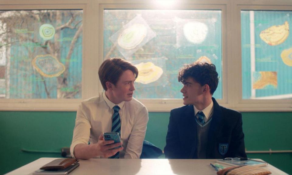 young men behind a table