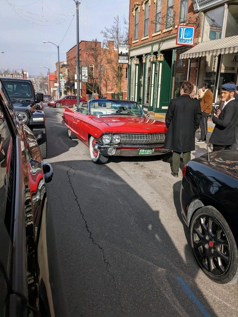 Purple Glove Productions of Mansfield is filming a surrealistic movie in Mansfield. Here a 1961 Cadillac is part of the scene with actors earlier this month.