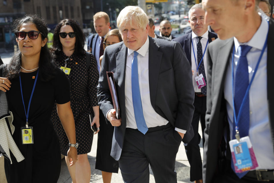 Britain's Prime Minister Boris Johnson walks down the street near United Nations headquarters in New York, Monday, Sept. 23, 2019. (AP Photo/Seth Wenig)